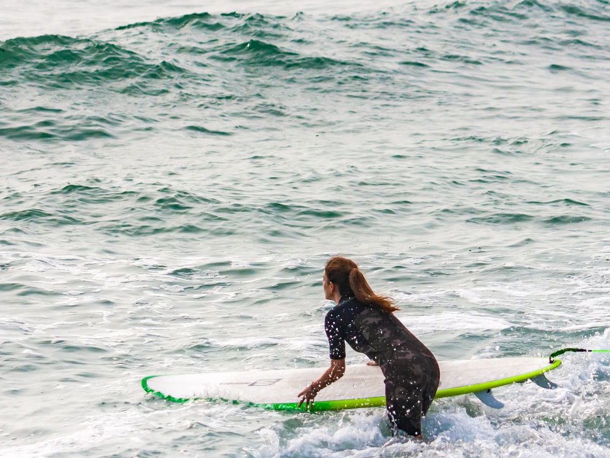 Surfer entering the water