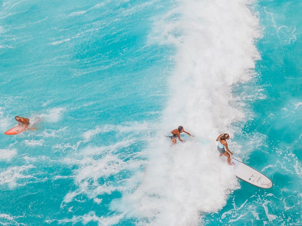 Aerial surf lineup in turquoise water